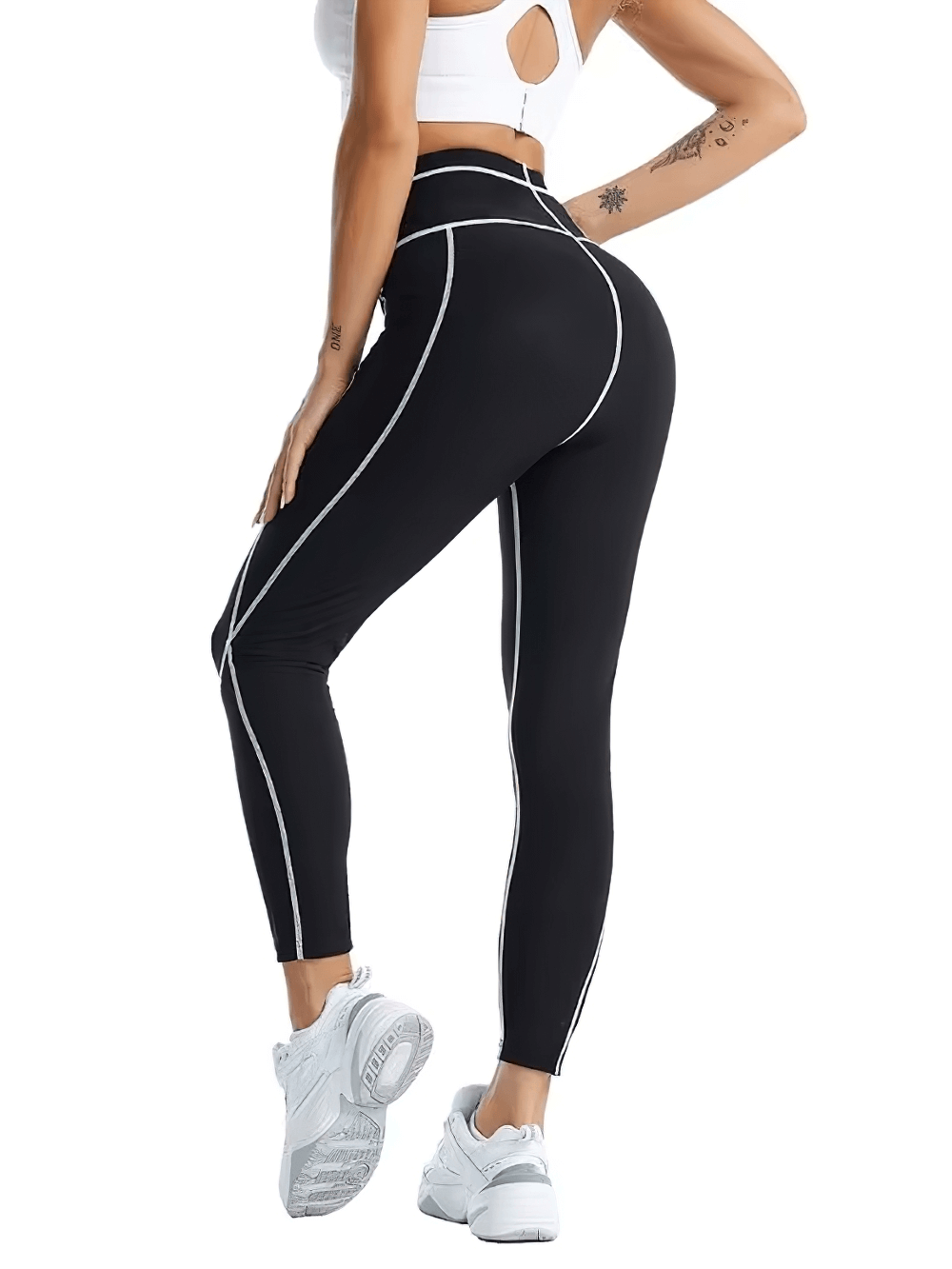 Woman wearing black thermo leggings for enhanced workout and fat burn, showcasing fitness and style with white sneakers.